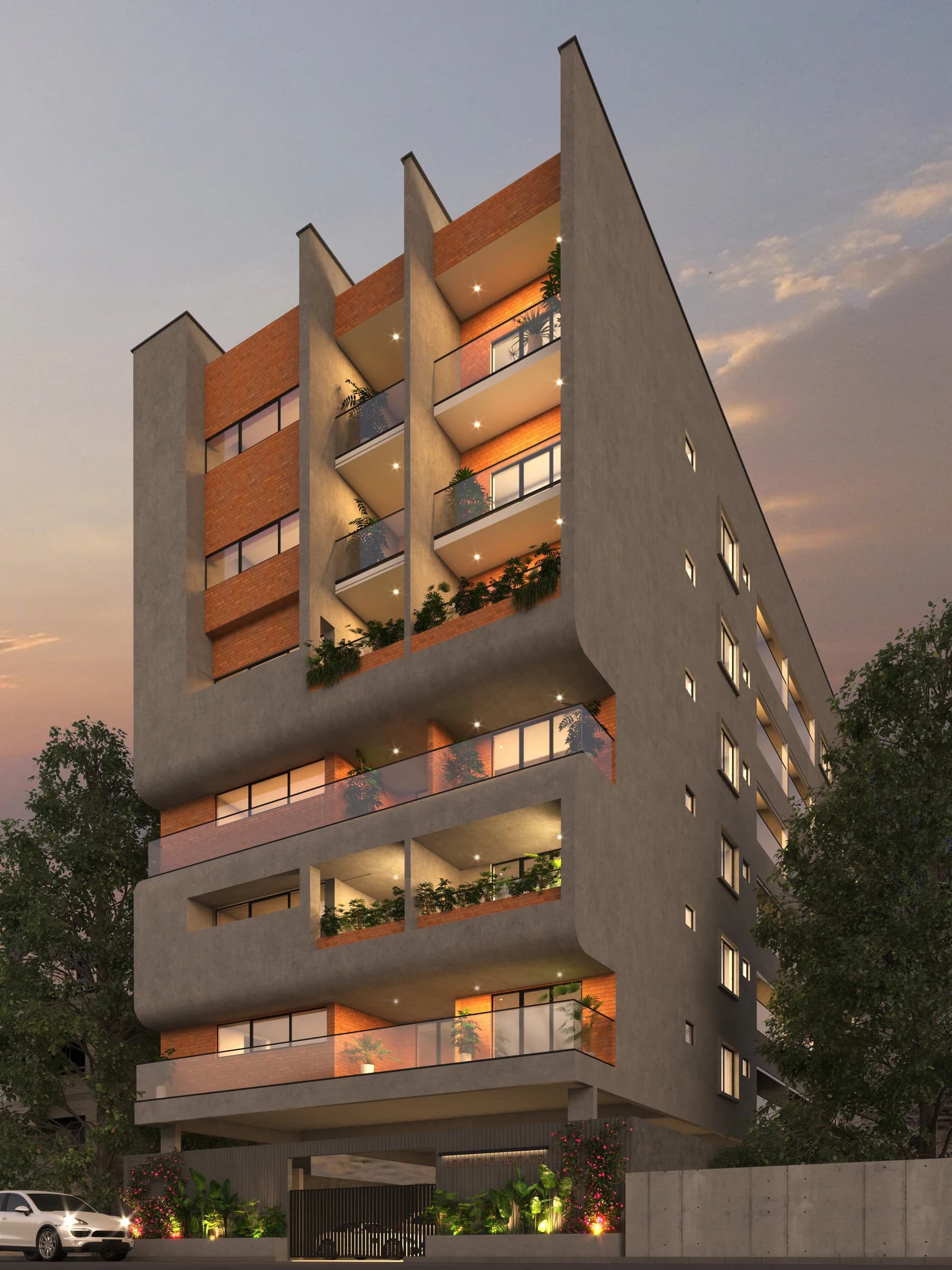 Evening exterior view of a multi-storey residential building